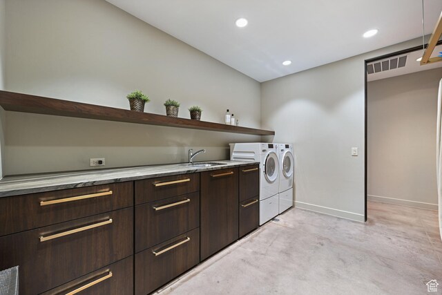 1748 N Cochise Dr, Ivins, UT 84738 - laundry room featuring washing machine and clothes dryer, baseboards, cabinet space, and recessed lighting