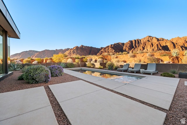 1748 N Cochise Dr, Ivins, UT 84738 - fenced backyard featuring a mountain view and a patio