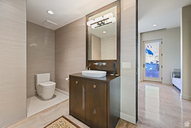 1748 N Cochise Dr, Ivins, UT 84738 - bathroom with vanity, toilet, tile walls, and baseboards