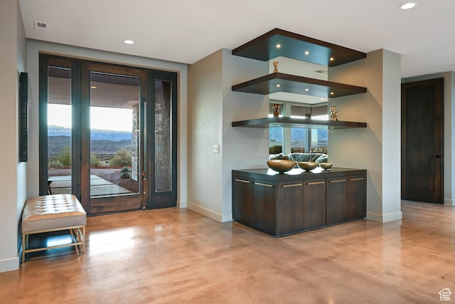 1748 N Cochise Dr, Ivins, UT 84738 - bar featuring concrete floors, baseboards, recessed lighting, and a mountain view