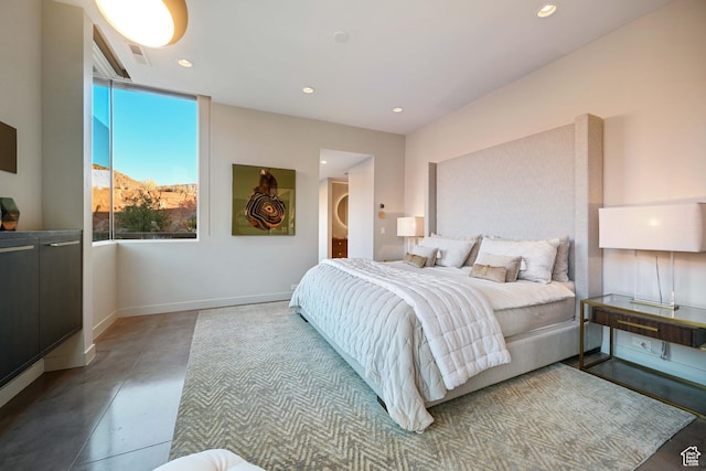 1748 N Cochise Dr, Ivins, UT 84738 - bedroom featuring finished concrete floors, baseboards, and recessed lighting
