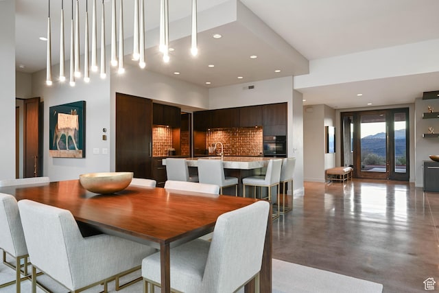 1748 N Cochise Dr, Ivins, UT 84738 - dining space featuring finished concrete floors and recessed lighting