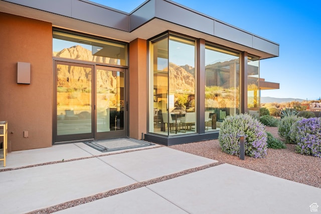 1748 N Cochise Dr, Ivins, UT 84738 - doorway to property featuring a patio area and stucco siding