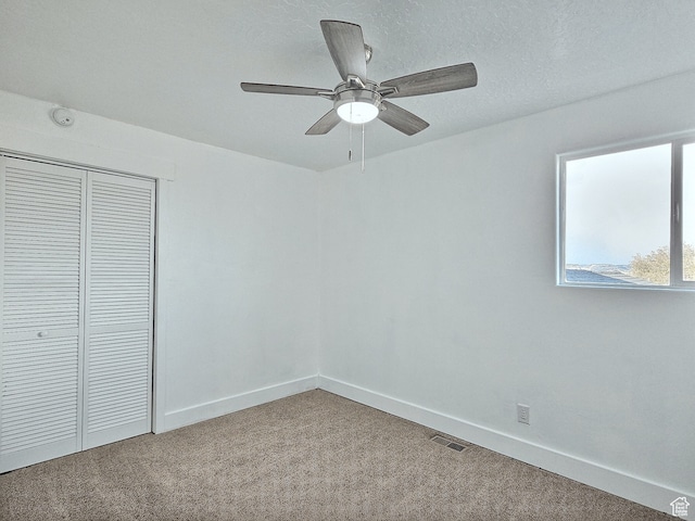 660 S 2500 W, Vernal, UT 84078 - unfurnished bedroom with carpet flooring, a textured ceiling, a closet, and ceiling fan