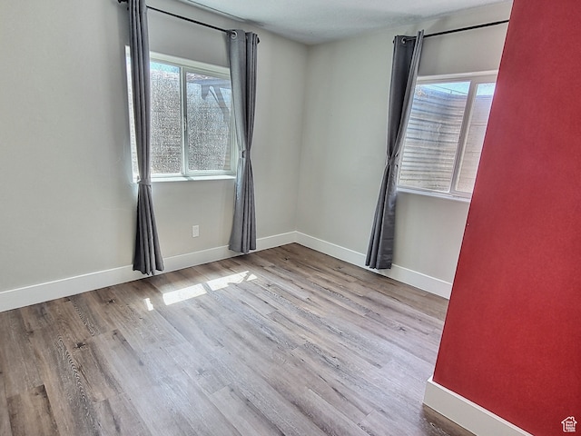 660 S 2500 W, Vernal, UT 84078 - empty room featuring plenty of natural light and light hardwood / wood-style floors