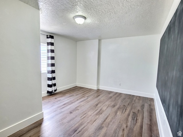 660 S 2500 W, Vernal, UT 84078 - unfurnished room featuring a textured ceiling and hardwood / wood-style flooring