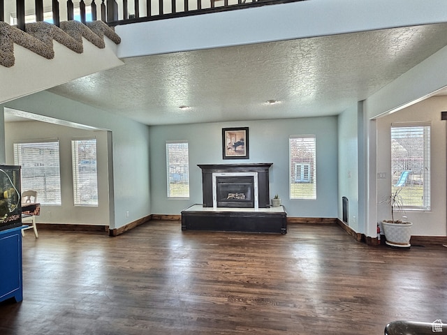 660 S 2500 W, Vernal, UT 84078 - unfurnished living room with dark wood-type flooring and a textured ceiling