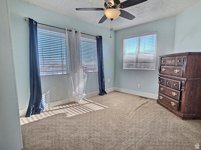 660 S 2500 W, Vernal, UT 84078 - unfurnished bedroom featuring a textured ceiling, light colored carpet, and ceiling fan