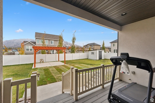 11959 S 235 E, Draper, UT 84020 - wooden terrace featuring a storage shed, an outdoor structure, a patio, a mountain view, and a pergola