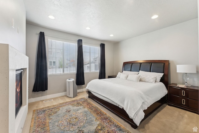 11959 S 235 E, Draper, UT 84020 - bedroom with recessed lighting, a warm lit fireplace, and baseboards