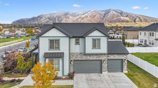 11959 S 235 E, Draper, UT 84020 - traditional-style home featuring board and batten siding, a mountain view, driveway, stone siding, and a garage