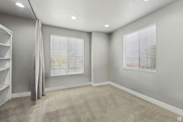 11959 S 235 E, Draper, UT 84020 - spare room featuring carpet floors, baseboards, recessed lighting, and a textured ceiling