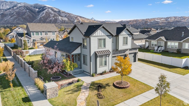 11959 S 235 E, Draper, UT 84020 - traditional-style house with board and batten siding, driveway, a residential view, a garage, and a mountain view