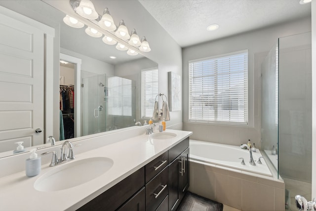 11959 S 235 E, Draper, UT 84020 - full bath featuring healthy amount of natural light, a shower stall, a garden tub, a walk in closet, and recessed lighting