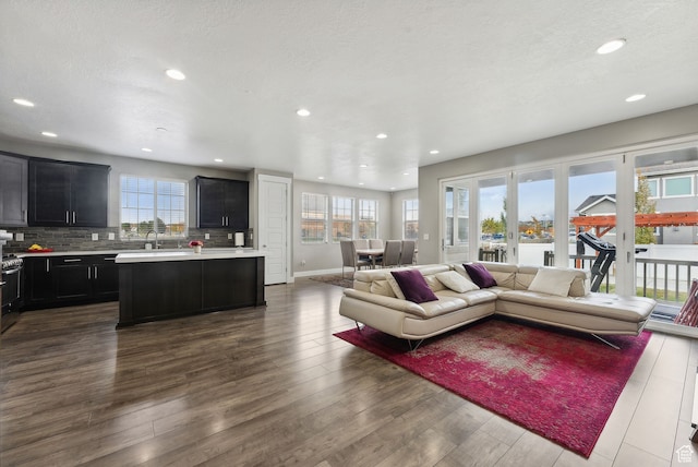 11959 S 235 E, Draper, UT 84020 - living room featuring plenty of natural light, recessed lighting, dark wood-style flooring, and baseboards