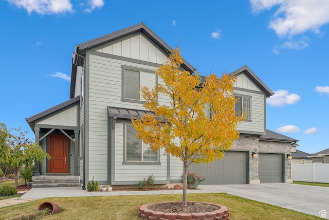 11959 S 235 E, Draper, UT 84020 - view of front of house featuring board and batten siding, concrete driveway, an attached garage, stone siding, and entry steps