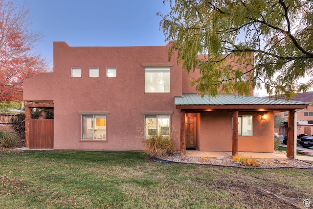 385 E Pueblo Ct, Moab, UT 84532 - rear view of property with a lawn