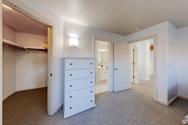 385 E Pueblo Ct, Moab, UT 84532 - interior space with a textured ceiling and carpet floors