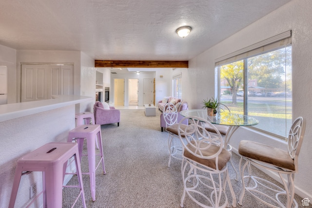 385 E Pueblo Ct, Moab, UT 84532 - carpeted dining area with beamed ceiling and a textured ceiling