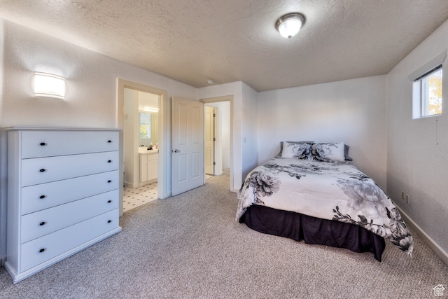 385 E Pueblo Ct, Moab, UT 84532 - carpeted bedroom featuring a textured ceiling and ensuite bathroom