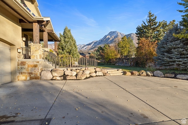 2745 E 4510 S, Holladay, UT 84117 - view of patio featuring a garage and a mountain view
