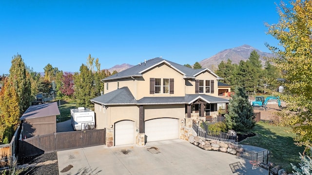 view of property featuring a mountain view and a garage