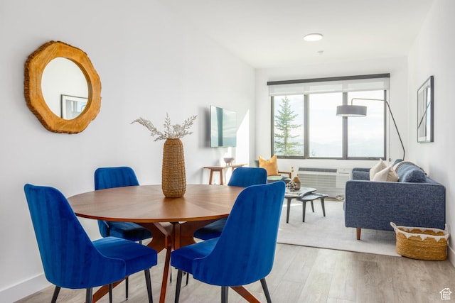 2303 Deer Hollow Rd Unit 1314, Park City, UT 84060 - dining area with a wall mounted AC and light wood-type flooring