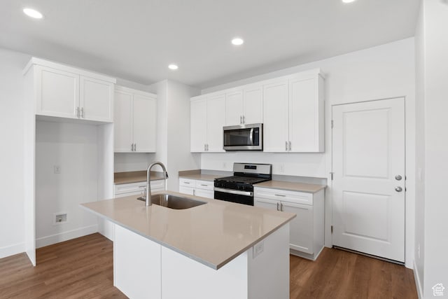 1084 E 1930 S Unit 423, Heber City, UT 84032 - kitchen featuring white cabinetry, appliances with stainless steel finishes, sink, and a center island with sink