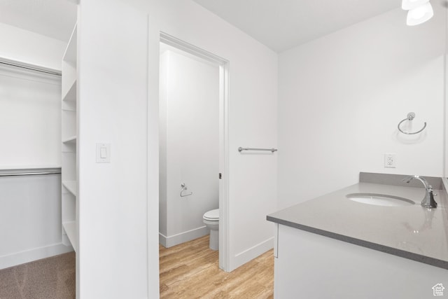 1084 E 1930 S Unit 423, Heber City, UT 84032 - bathroom with vanity, hardwood / wood-style floors, and toilet