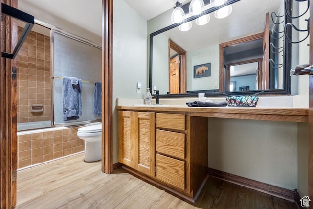 150 W Ridgeview St Unit 220, Brian Head, UT 84719 - full bathroom featuring wood-type flooring, tiled shower / bath combo, toilet, and vanity