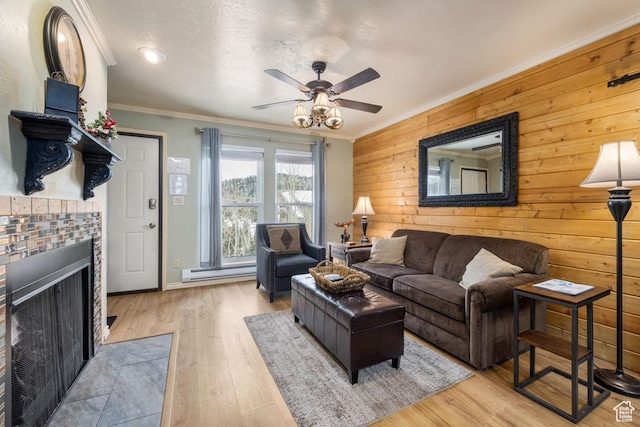 150 W Ridgeview St Unit 220, Brian Head, UT 84719 - living room with crown molding, light wood-type flooring, a brick fireplace, baseboard heating, and ceiling fan