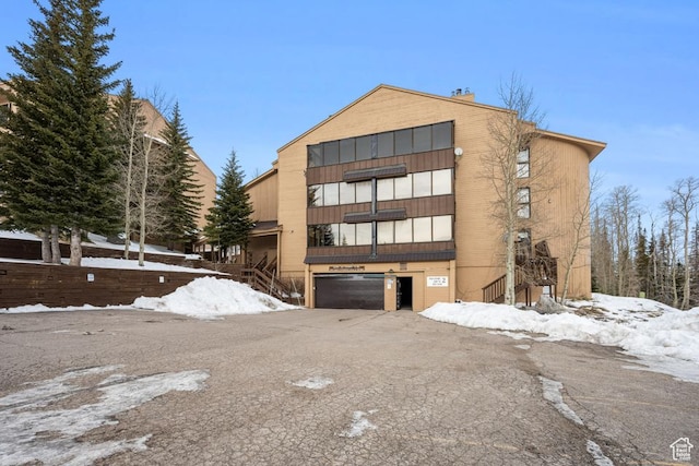 150 W Ridgeview St Unit 220, Brian Head, UT 84719 - snow covered building featuring a garage