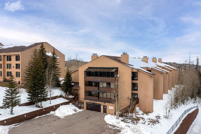 150 W Ridgeview St Unit 220, Brian Head, UT 84719 - snow covered building with a garage