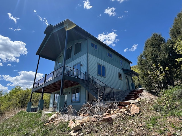 1400 N Cisco Cir, Garden City, UT 84028 - rear view of property featuring stairway, board and batten siding, and a deck