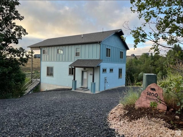 1400 N Cisco Cir, Garden City, UT 84028 - back of property at dusk featuring board and batten siding and roof with shingles