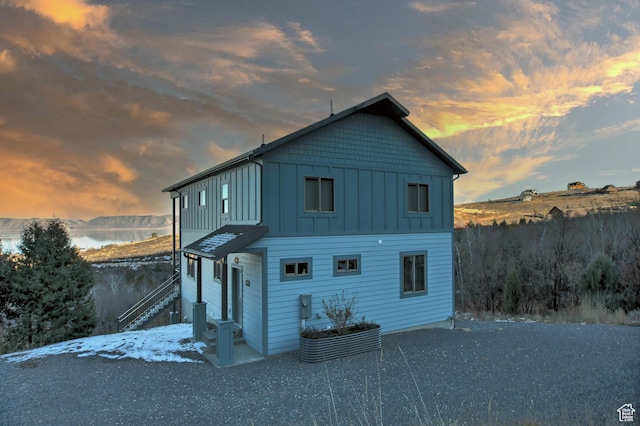1400 N Cisco Cir, Garden City, UT 84028 - back of property at dusk with board and batten siding and stairway