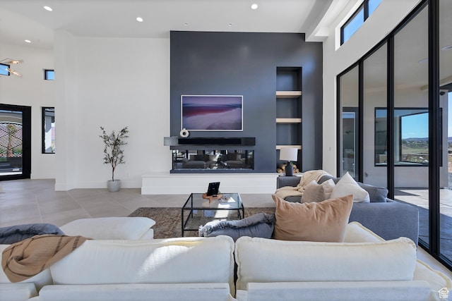 3967 N Hillside Way, Santa Clara, UT 84765 - tiled living room featuring a high ceiling and built in shelves