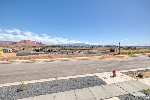 3967 N Hillside Way, Santa Clara, UT 84765 - view of street featuring a mountain view, curbs, and sidewalks