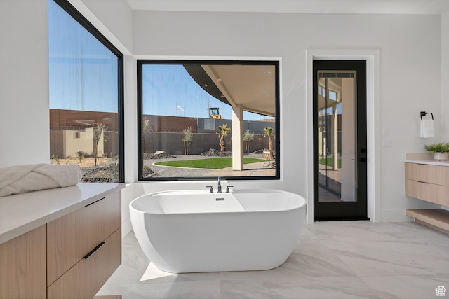 3967 N Hillside Way, Santa Clara, UT 84765 - bathroom with a bath, a healthy amount of sunlight, and vanity