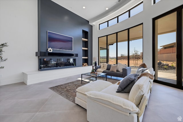 3967 N Hillside Way, Santa Clara, UT 84765 - living room with a towering ceiling, built in features, and light tile patterned floors