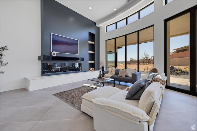 3967 N Hillside Way, Santa Clara, UT 84765 - tiled living room featuring built in features, baseboards, a towering ceiling, and recessed lighting