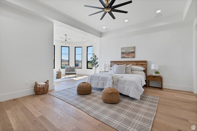 3967 N Hillside Way, Santa Clara, UT 84765 - bedroom featuring light wood-type flooring and ceiling fan with notable chandelier