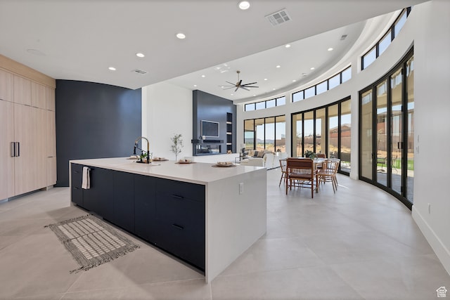 3967 N Hillside Way, Santa Clara, UT 84765 - kitchen featuring a spacious island, light brown cabinetry, ceiling fan, and sink