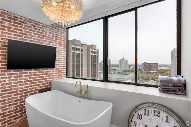 44 W Broadway S Unit 1205S, Salt Lake City, UT 84101 - bathroom with a notable chandelier, sink, hardwood / wood-style floors, a washtub, and brick wall