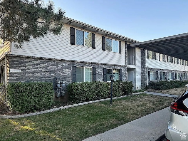 view of home's exterior with a lawn