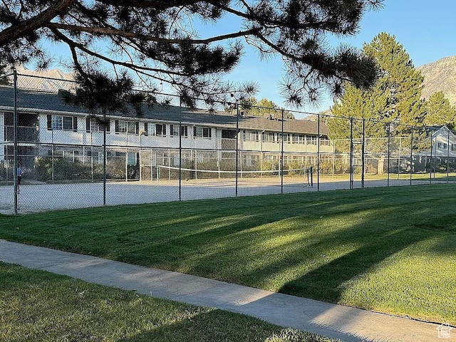 view of community with tennis court