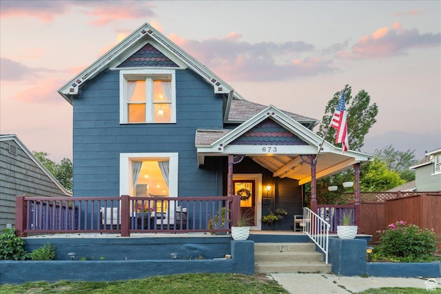 673 E 7th Ave, Salt Lake City, UT 84103 - victorian house with a porch and fence