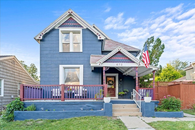 673 E 7th Ave, Salt Lake City, UT 84103 - victorian house featuring fence and covered porch