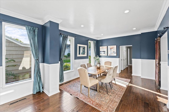 673 E 7th Ave, Salt Lake City, UT 84103 - dining space with hardwood / wood-style flooring, a barn door, recessed lighting, wainscoting, and crown molding