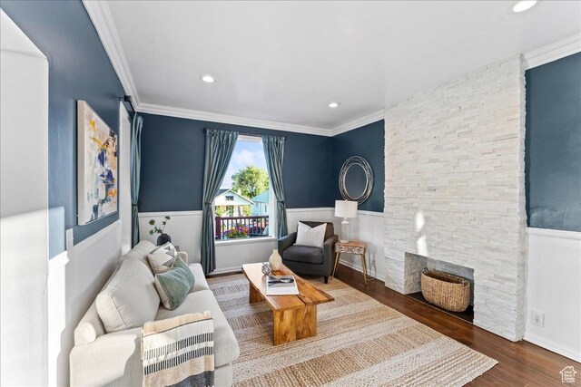 673 E 7th Ave, Salt Lake City, UT 84103 - sitting room featuring wood finished floors, recessed lighting, a stone fireplace, ornamental molding, and a wainscoted wall